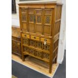 A 19th-century Chinese cypress wood side cabinet, width 106cm, depth 51cm, height 177cm