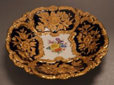An early 20th Meissen century gilt floral blue and white dish, 27.5cm diameter