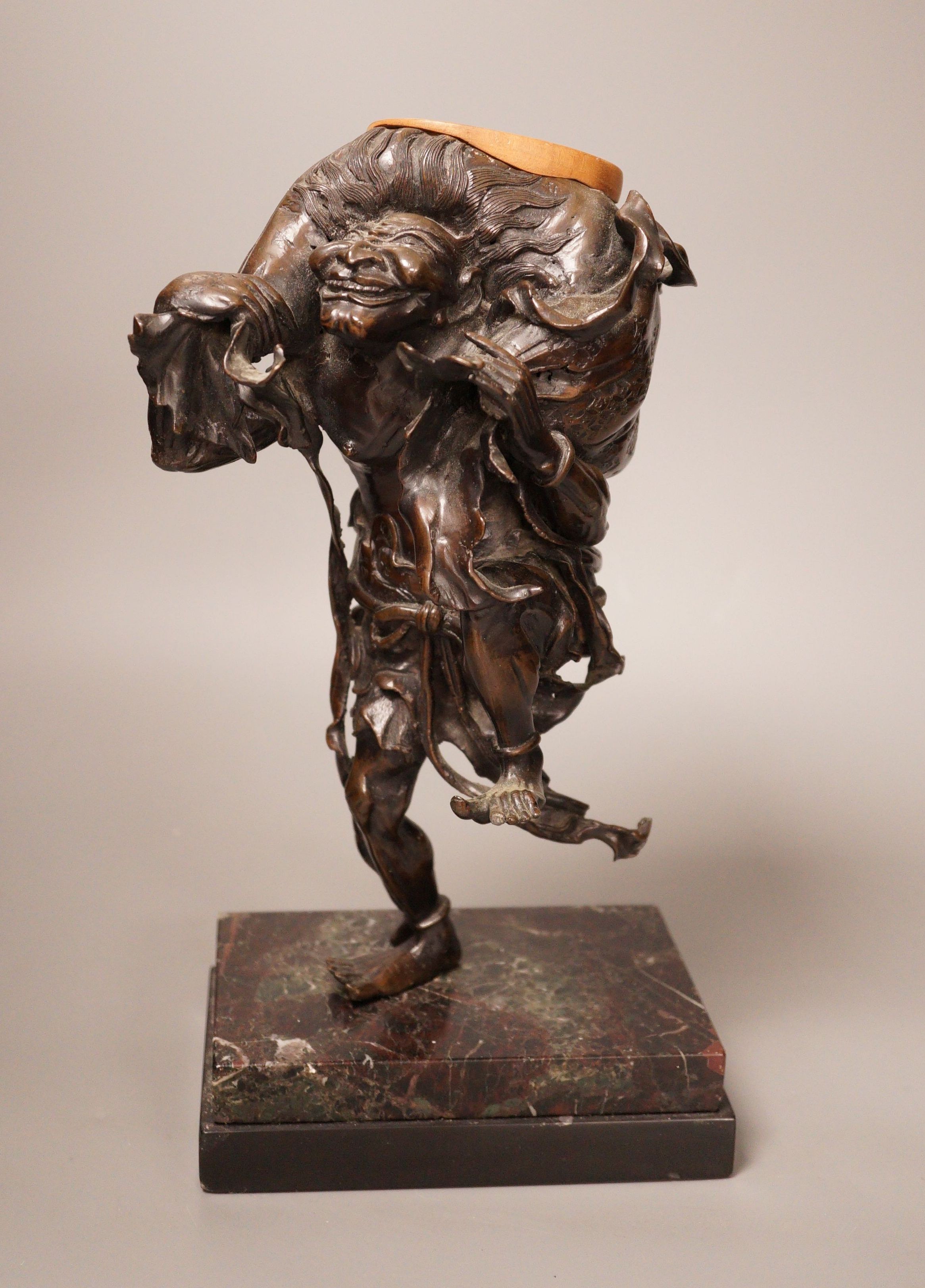 A Meiji period Japanese bronze figural censer, study of a demon, 31cm