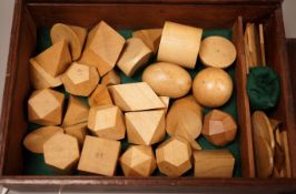 A mahogany cased set, Edwards Geometrical Planes and Solids': 19th century educational carved wooden