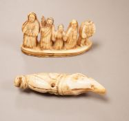 An Innuit whale tooth carving, 19th century, 8cm long, and a marine ivory religious group,