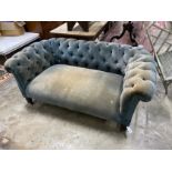 A late Victorian Chesterfield settee upholstered in buttoned blue fabric, length 160cm, depth