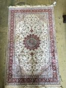 A Tabriz ivory ground part silk rug with central floral medallion, 150 x 95cm
