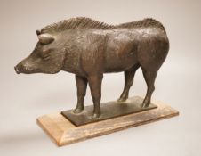 A 20th century bronze model of a standing boar, on inset wooden base, height 17cm, length of boar