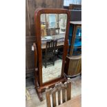 A Victorian style mahogany cheval mirror, the rectangular plate enclosing hanging space and