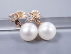 A pair of gold mounted diamond and cultured pearl drop earrings