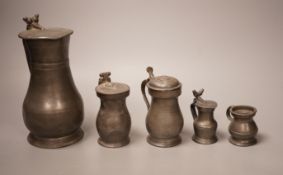 A group of 18th / 19th century pewter measures, 19cm