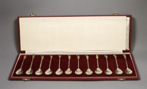 A set of twelve parcel gilt silver commemorative Tichborne spoons, in presentation case, 9oz