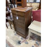 An early 20th century oak tambour filing cabinet, (no lock), width 49cm, depth 41cm, height 103cm