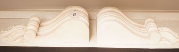 A pair of carved white marble scrolling corbels, 38x14cm