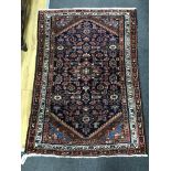 A North West Persian blue ground rug, 136 x 92cm