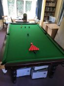 An early 20th century mahogany three quarter size snooker table on six turned tapered legs,
