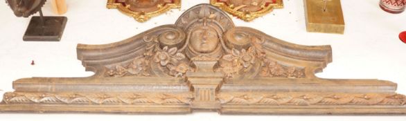 A wall mounted cast iron architectural pediment, 101cm