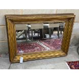 A rectangular gilt gesso wall mirror, width 88cm, height 63cm