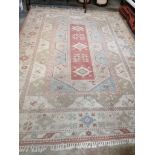 A Caucasian style polychrome geometric carpet, 360 x 260cm