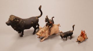 Four Austrian cold painted bronze miniature groups or figures, two of the devil riding a pig and two