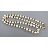 A modern 18ct gold and graduated white coral bead set single strand necklace, with 18ct gold