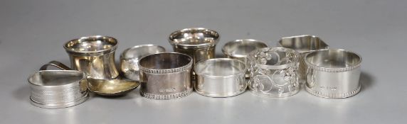 Nine assorted silver napkin rings including a pair of late Victorian and later pair, one other