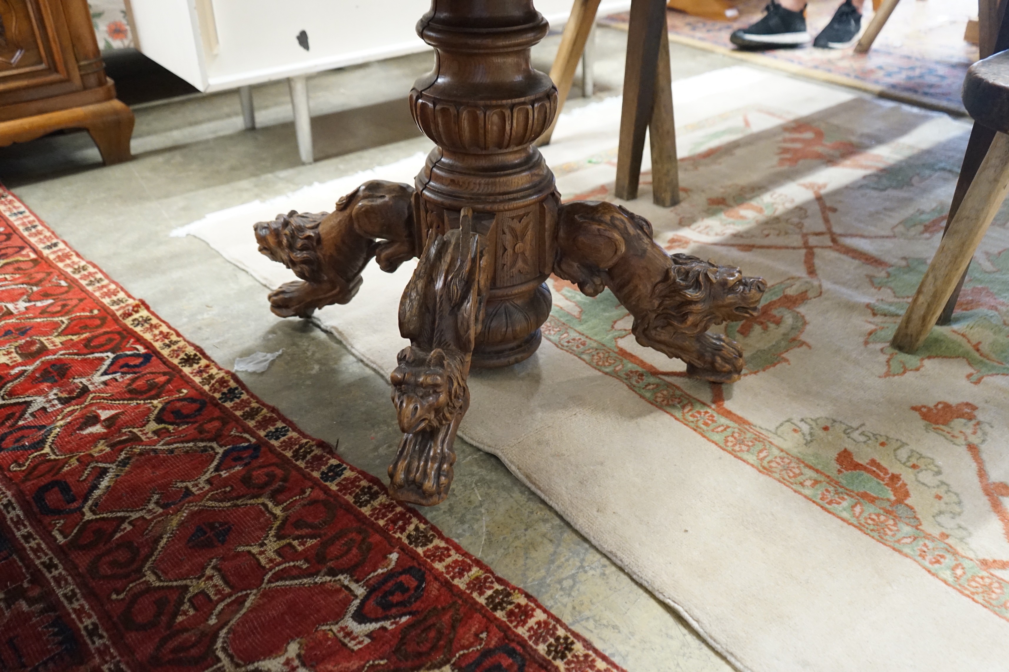 An early 20th century Continental carved oak circular centre table with heraldic tapestry top on - Image 3 of 4