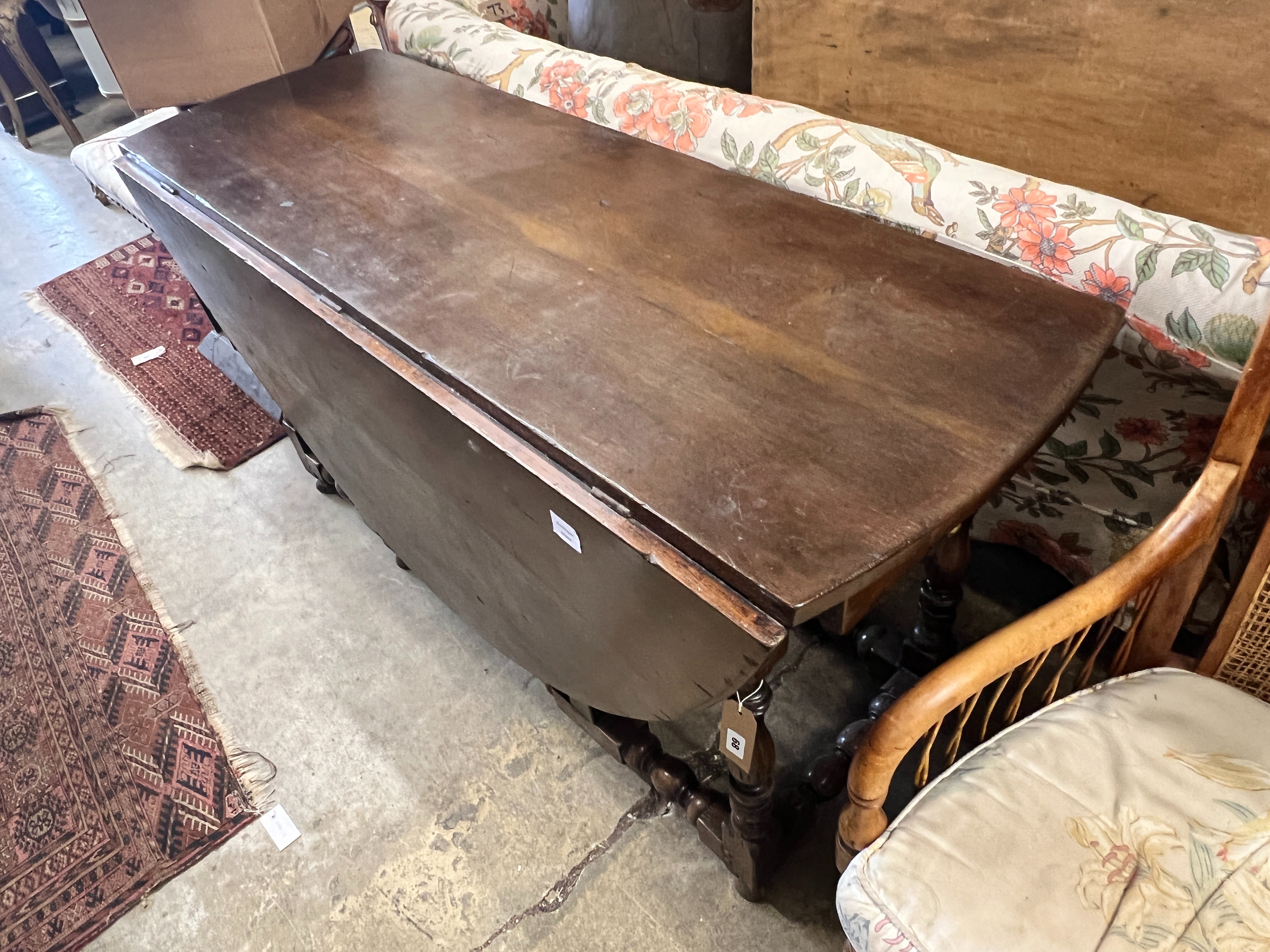 An early 18th century style oak oval topped gateleg dining table, (one leaf in need of repair), - Image 2 of 5