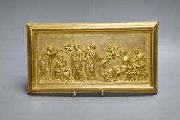 A gilt metal plaque depicting a classical scene, 15x27cm