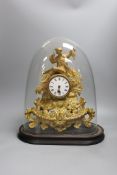 A Victorian gilt spelter mantel clock, under dome,40 cms high,
