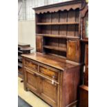 A Victorian oak dresser with boarded rack, width 148cm, depth 58cm, height 206cm