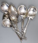 Three 20th century Scandinavian 830 standard white metal ornate spoons, a sterling spoon and three