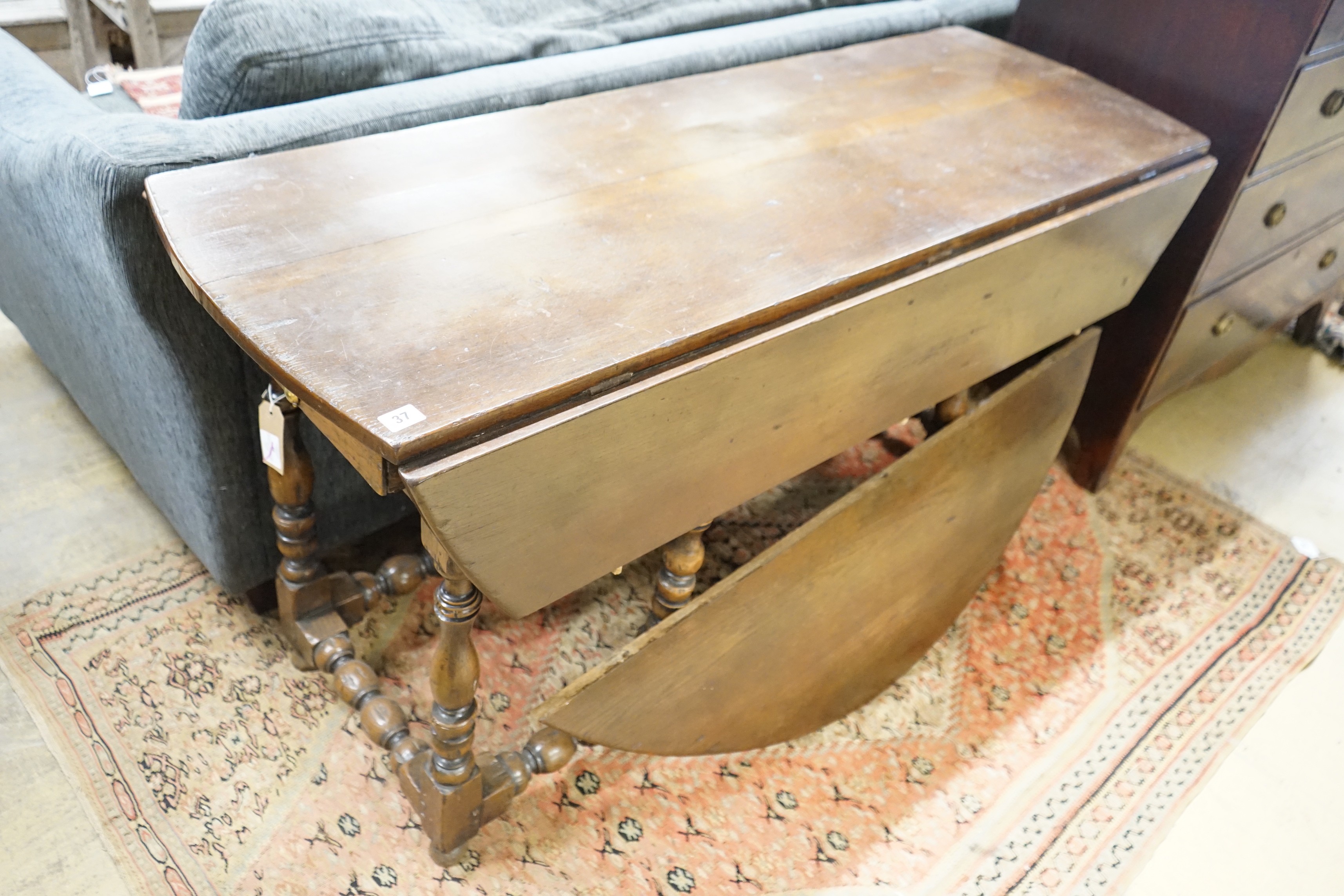 An early 18th century style oak oval topped gateleg dining table, (one leaf in need of repair), - Image 5 of 5