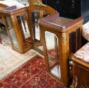 A pair of early 20th French birds eye maple glazed cabinets and central mirror, formerly a cabinet