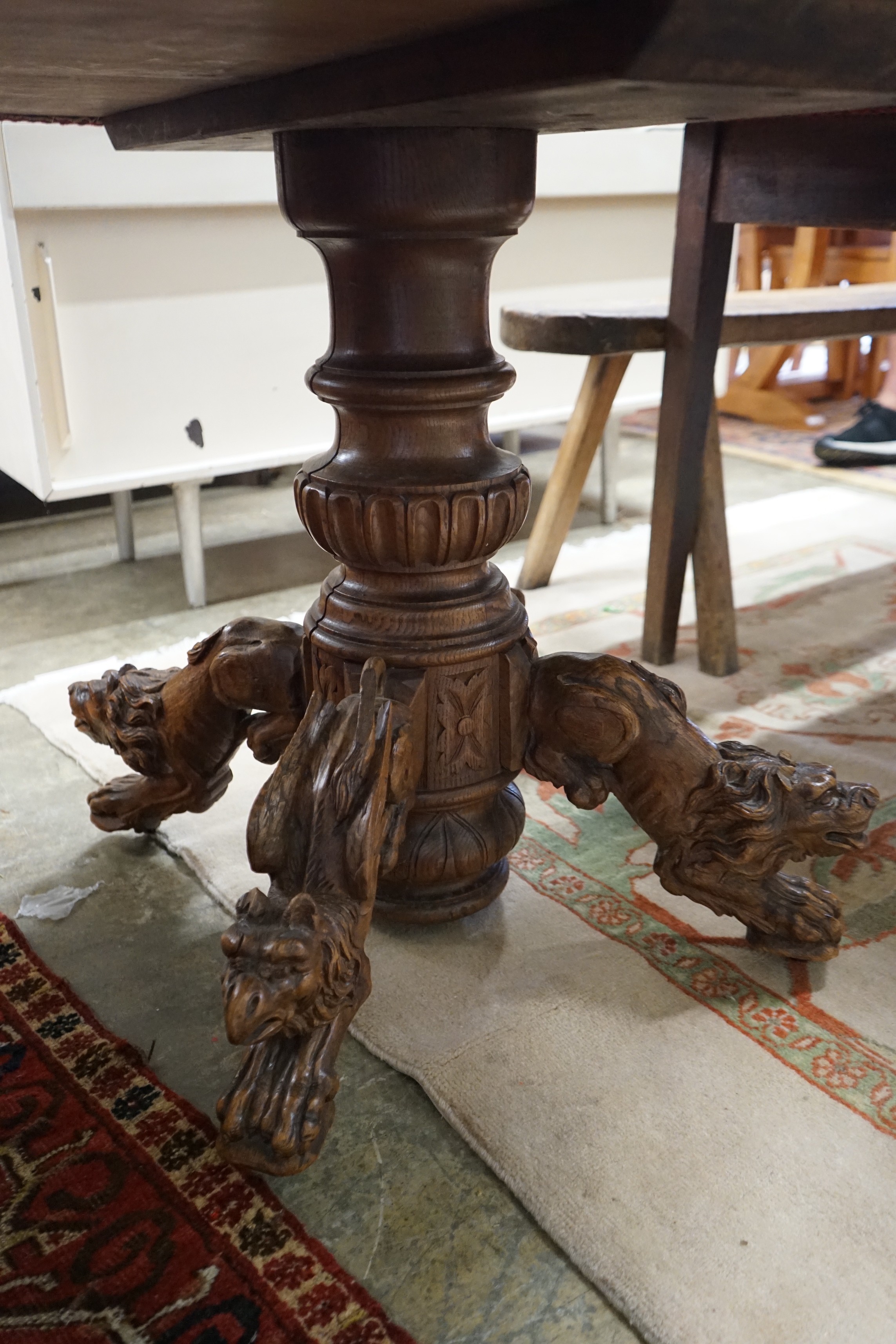 An early 20th century Continental carved oak circular centre table with heraldic tapestry top on - Image 2 of 4