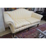 A Victorian scroll arm settee upholstered in ivory and gold striped fabric, length 186cm, depth