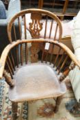 A mid 19th century Yorkshire area Windsor yew and elm elbow chair with crinoline stretcher, width