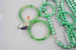 A group of three jadeite necklaces, together with two jadeite bracelets, two green glass bangles and
