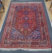 A North West Persian red ground carpet, 240 x 170cm