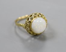 A 750 yellow metal and cabochon white opal set ring, with pierced setting, size U/V, gross weight