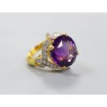 A modern yellow metal, round cut amethyst and diamond chip set cluster dress ring, size M, gross