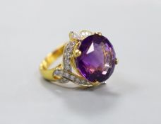 A modern yellow metal, round cut amethyst and diamond chip set cluster dress ring, size M, gross