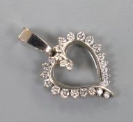 A white metal and diamond set open work heart pendant, overall 36mm, gross weight 4.8 grams.