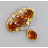 A Victorian pinchbeck and four stone oval cut citrine set drop brooch, width 64mm.