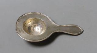A Chinese Export white metal tea strainer, maker TC, 14.2cm, 47 grams.