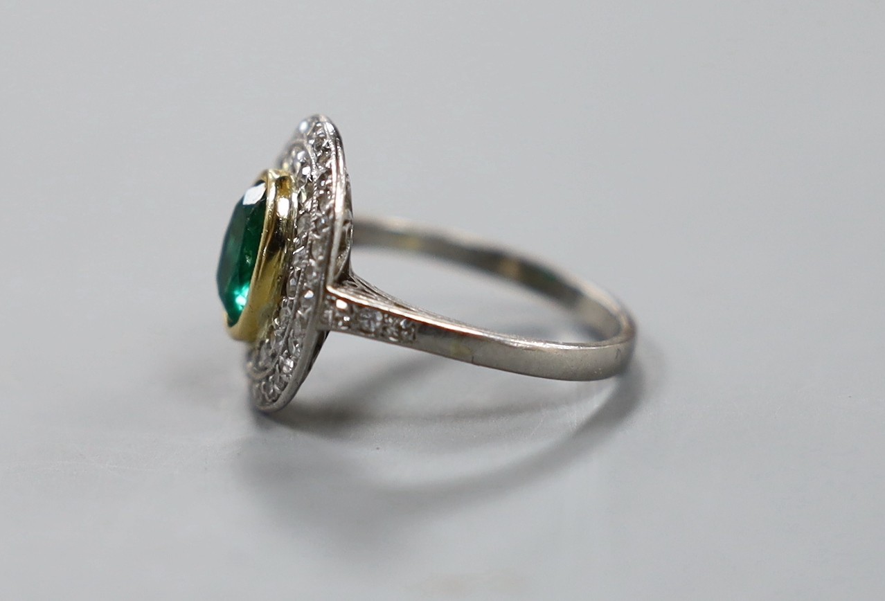 A white metal, emerald and diamond set oval cluster ring, size I/J, gross weight 3.8 grams. - Image 2 of 3