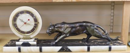 An Deco spelter and marble panther mantel clock on plinth base, 80cm wide