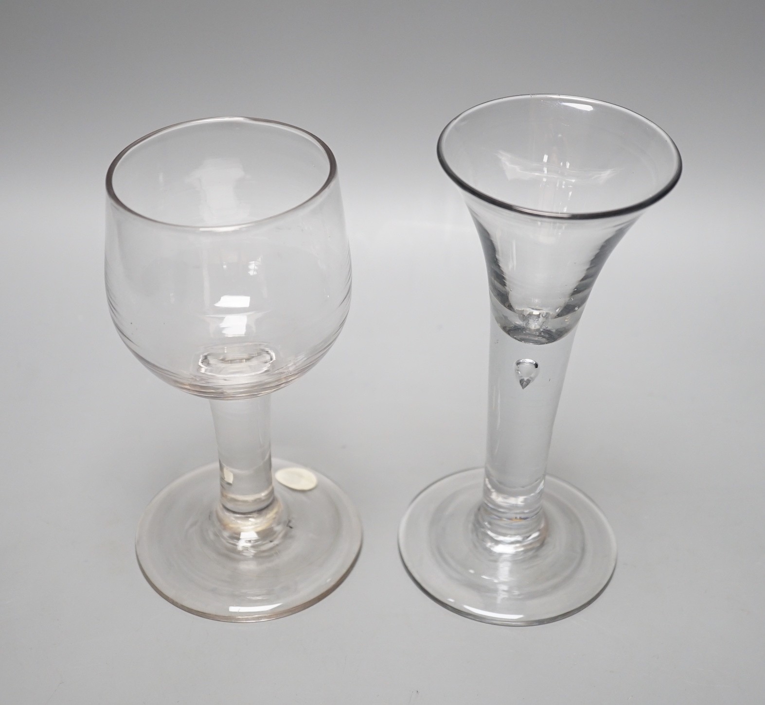 A mid 18th century mead glass and a similar drawn trumpet ale glass, tallest 17cm