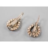 A pair of Indian? yellow metal and rose cut diamond set pear shaped earrings (stone missing),