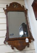 A George III style walnut and parcel gilt fret cut mirror, width 42cm, height 81cm