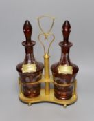 A pair of Bohemian cut glass decanters on gilt metal stand with ‘WHISKY’ and ‘SHERRY’ labels, 38cm