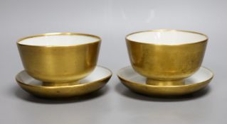 A pair of Paris porcelain gilded tea bowls and saucers , first half of 19th century,saucer 13cms