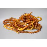 A group of amber and simulated amber bead necklaces (6).