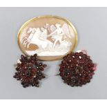 Two Victorian garnet set brooches, largest 3.5cm and a gold mounted cameo brooch, 5.5cm